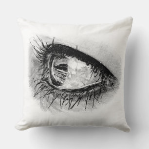 Beautiful woman eye in full mascara on pillow