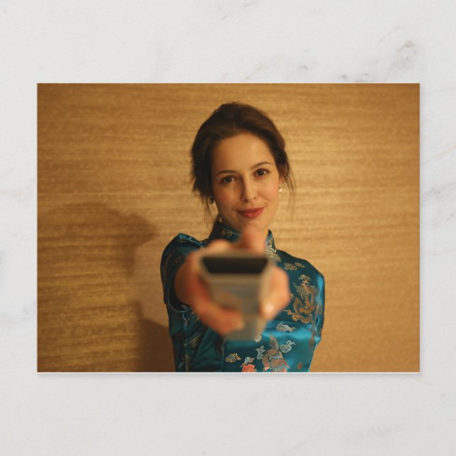 Beautiful Woman holding a remote control Postcard (Front)