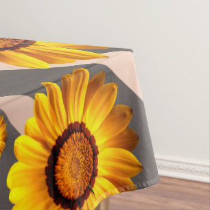 Beautiful yellow flowers on gray, brown stripes tablecloth