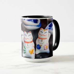 Beckoning cat figurines mug