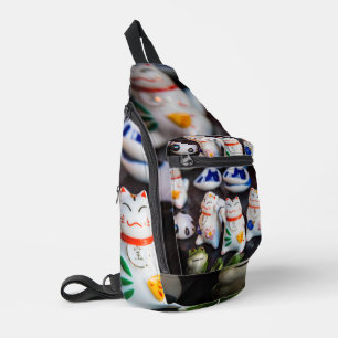 Beckoning cat figurines sling bag
