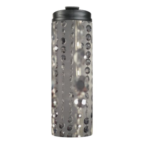 Bedazzling shiny beads on thermal tumbler