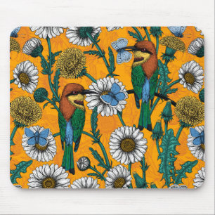 Bee-eaters, blue butterflies and daisies on orange mouse pad