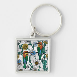 Bee-eaters, blue butterflies and daisies on white keychain