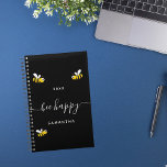 Bee happy black cute bumble bees monogram 2025 planner<br><div class="desc">Decorated with happy,  smiling yellow and black  bumble bees. A chic black background. White hand lettered script with swashes and the text: Bee Happy.  Personalize and add your name and a year. Perfect for school,  work or organizing your personal/family life.</div>