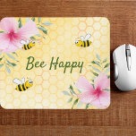 Bee Happy bumble bees yellow honeycomb floral Mouse Pad<br><div class="desc">Yellow,  white background with a honeycomb pattern. Decorated with pink tropical florals flowers,  hibiscus and happy bumble bees. The text: Bee Happy in green hand lettered style script. Perfect for your summer home work space,  office!</div>