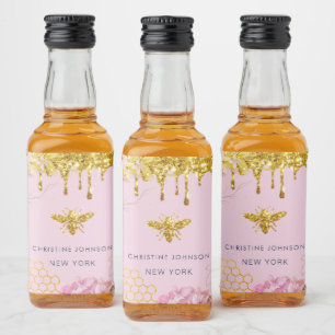 bee logo and pink hydrangea liquor bottle label