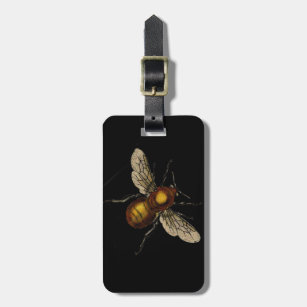 Bee on black luggage tag
