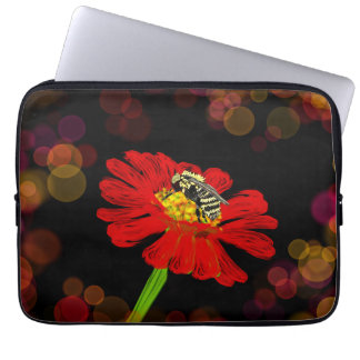 bee on red laptop sleeve