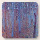 Beech Forest by Gustav Klimt, Vintage Art Nouveau Drink Coaster<br><div class="desc">Beech Forest (1902) by Gustav Klimt is a vintage Victorian Era Symbolism fine art landscape painting featuring a nature scene. A dark forest with beech trees and leaves at night. About the artist: Gustav Klimt (1862-1918) was an Austrian Symbolist painter and one of the most prominent members of the Vienna...</div>