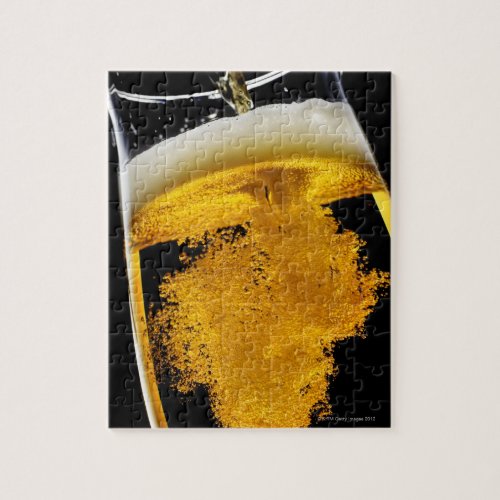 Beer been poured into glass jigsaw puzzle