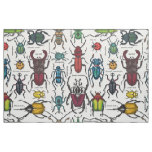 Beetles on white fabric