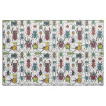 Beetles on white fabric