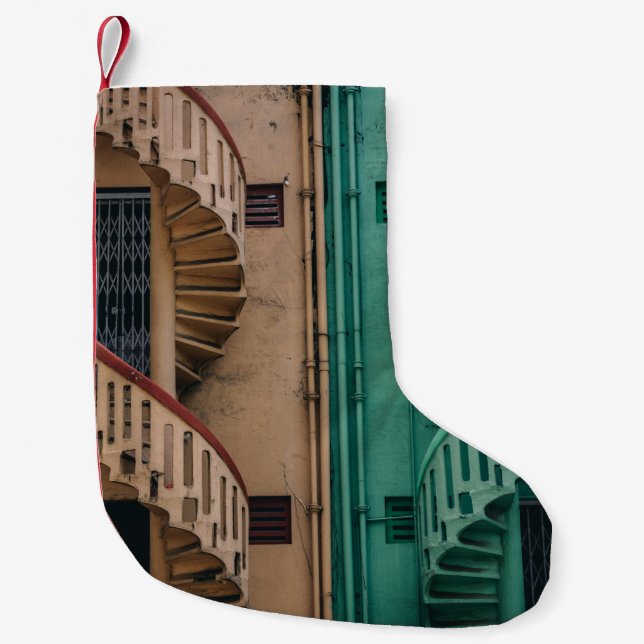 Beige and green concrete spiral stairs beside buil small christmas stocking (Front)