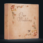 Beige Vintage Lilies Wedding Photo Album Binder<br><div class="desc">Beautiful wedding photo album with vintage floral lilies with a hummingbird. Placed on a soft beige background that has a slight texture effect applied and a darker edge for an old paper look. This design also comes on many other ready to customize template products and can be placed on many...</div>