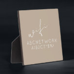 Beige WiFi Password Sign Easel Stand Plaque<br><div class="desc">Keep your guests connected with this stylish and functional WiFi password sign plaque. The elegant beige design with a delicate script font makes it the perfect addition to any home or office decor. The 5.25x5.25 plaque comes with a convenient easel stand for easy display. Simply write your WiFi password on...</div>