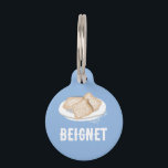 BEIGNET PET ID TAG<br><div class="desc">Indulge in the flavor of New Orleans with this delightful Beignet Pet ID Tag! Dusted with a sweet design of New Orleans' favorite treat, this tag is a perfect accessory for your furry friend with a taste for the good life. Whether strolling through the French Quarter or lounging at home,...</div>