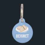BEIGNET PET ID TAG<br><div class="desc">Indulge in the flavor of New Orleans with this delightful Beignet Pet ID Tag! Dusted with a sweet design of New Orleans' favorite treat, this tag is a perfect accessory for your furry friend with a taste for the good life. Whether strolling through the French Quarter or lounging at home,...</div>