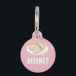 BEIGNET PET ID TAG<br><div class="desc">Treat your pet to a dash of sweetness with this charming Beignet Pet ID Tag! Featuring a cute depiction of New Orleans' famous powdered confection, this tag is as adorable as it is practical. It's the perfect way to keep your pet identified while giving a nod to delightful Southern comforts....</div>