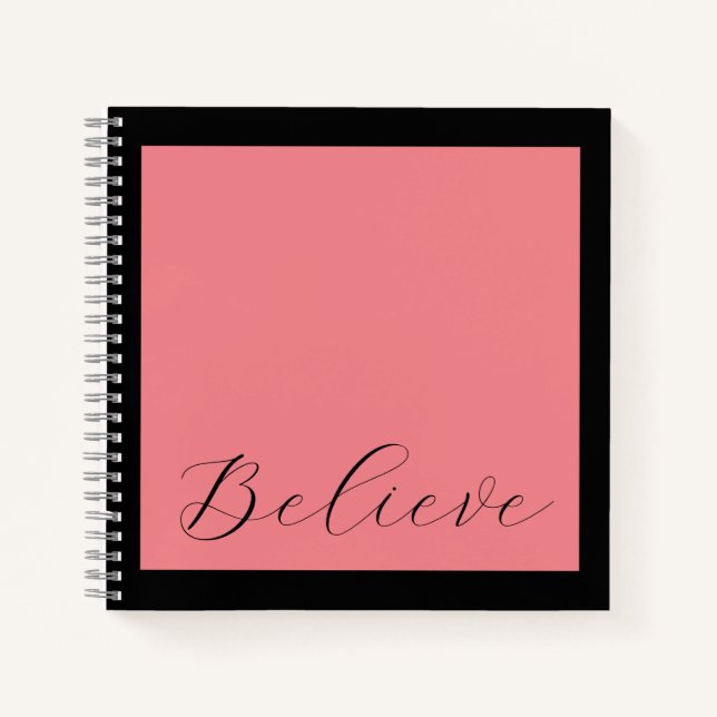 'Believe' Black Script Coral Pink Background Notebook (Front)