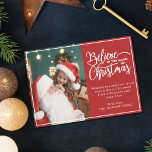 Believe in Christmas magic 2 family photos red Holiday Card<br><div class="desc">Modern holiday greeting card featuring one of your favorite Christmas family portraits on the left complemented by the words "Believe in the magic of Christmas" on the right over a festive red background, customizable with your own greeting message. You can upload one more picture on the reverse of the card....</div>