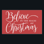 Believe in the magic of Christmas red Rectangular Sticker<br><div class="desc">Modern holiday greeting sticker featuring the wordings "Believe in the magic of Christmas" over a festive red background.</div>