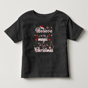 Believe In The Magic Of Christmas Xmas Quotes Des Toddler T-shirt
