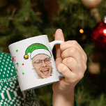 Believe In Your Elf Fun Photo Christmas Coffee Mug<br><div class="desc">Make your mornings jollier with our fun elf photo coffee mug! This unique product features a charming photo of you, adorned with a charismatic elf hat. Also, take delight in the empowering quote 'BELIEVE IN YOUR ELF' - Personalized with your name for that special touch. And guess what? You can...</div>