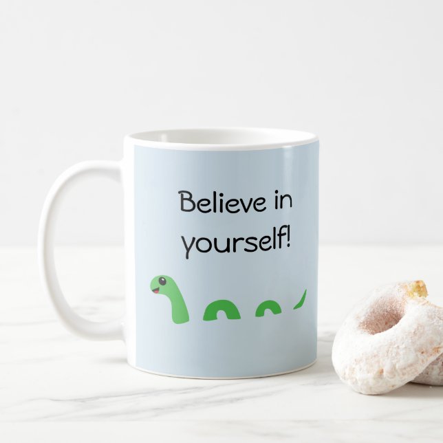 Believe in Yourself Cartoon Loch Ness Monster Coffee Mug (With Donut)
