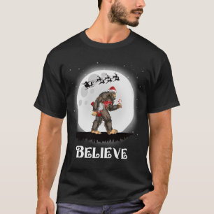 Believe Santa Bigfoot Carrying Gnome Christmas T-Shirt
