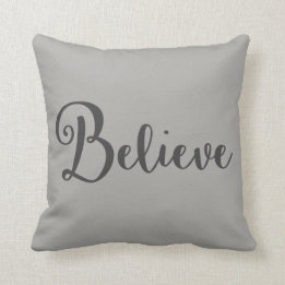"Believe" Text in Dark Gray on Gray Pillow