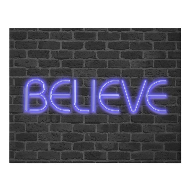 Believe text in neon lights on brick faux canvas print (Front)