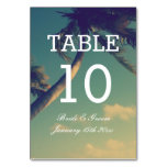 Bent palm tree beach theme wedding reception table number
