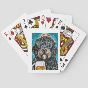Bernedoodle holding a beer mug poker cards