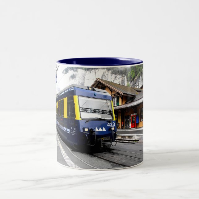 Berner Oberland bahn train in Switzerland Two-Tone Coffee Mug (Center)