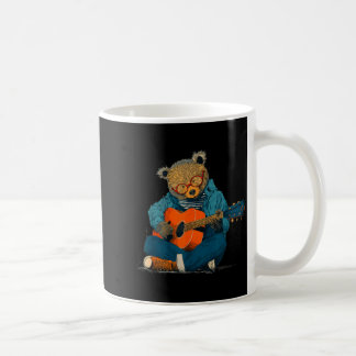 Bespectacled teddy with acoustic guitar costume coffee mug