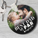 Best Dad By Par Photo Keychain<br><div class="desc">This personalized keychain is a perfect way to celebrate the "Best Dad By Par." The design features a bold mix of typography with script fonts, creating a stylish and meaningful message. A black gradient at the bottom fades into a customizable photo, which can feature the gifter, a father with his...</div>