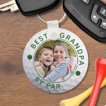BEST GRANDPA BY PAR Photo Golf Ball Custom Keychain<br><div class="desc">Create a unique, personalized photo keychain for the golfer grandfather with the editable funny golf title BEST GRANDPA BY PAR and your custom text in your choice of colors (shown in green) on a golf ball image. The design is duplicated on both sides. ASSISTANCE: For help with design modification or...</div>
