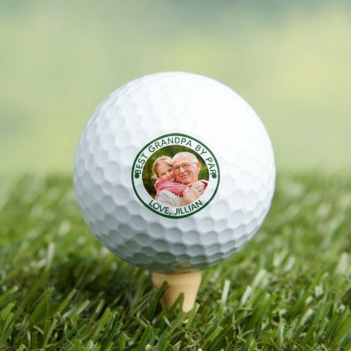 BEST GRANDPA BY PAR Photo Green Personalized Golf Balls - Create a custom personalized photo golf balls for a golfer grandfather with the editable funny title BEST GRANDPA BY PAR and name(s) or other custom text shown in an editable green text color you can change to a complementary color to your picture, his golf bag or his favorite color. Memorable keepsake gift for Grandparents Day, Fathers Day or his birthday. ASSISTANCE:  For help with design modification or personalization, color change or transferring the design to another product, contact the designer BEFORE ORDERING via the Zazzle Chat MESSAGE tab below or email makeitaboutyoustore@gmail.com.