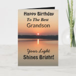 Best Grandson Light Shines Bright Birthday Card<br><div class="desc">Express your wishes to your grandson for a happy day on an inspirational sunset birthday card with the verse “Your Light Shines Bright”. The minimal design is modern with bold colors of gold and black showing glowing water and a peaceful lake.</div>