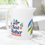 Best Mother in the World | Mother's Day Teapot<br><div class="desc">Sip your favorite tea with a touch of elegance and sentimentality with this stunning "Best mother in the world" teapot adorned with a beautiful blue watercolor flower design. The vibrant blue flowers and green leaves pop against the white porcelain background, making it a stylish and eye-catching addition to your kitchenware....</div>