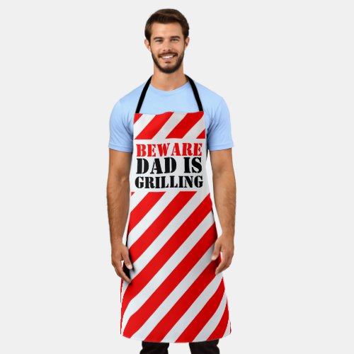 BEWARE Dad is grilling graphic red caution stripes Apron
