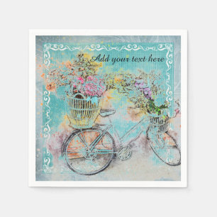 Bicycle with flower baskets on blue burlap napkins