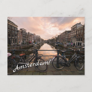 Bicycles at sunset in Amsterdam Postcard