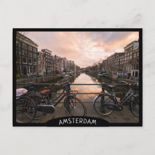 Bicycles at sunset in Amsterdam Postcard