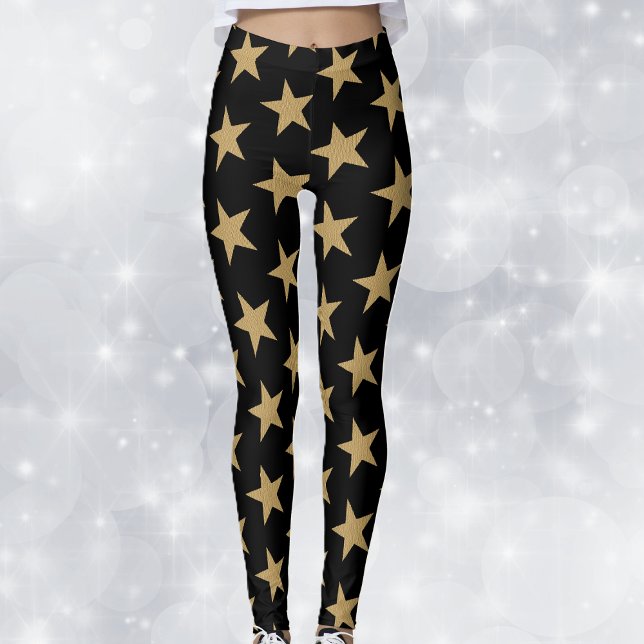 Big Gold Christmas Stars on Black Leggings (Big festive gold holiday stars on black woman's leggings.)