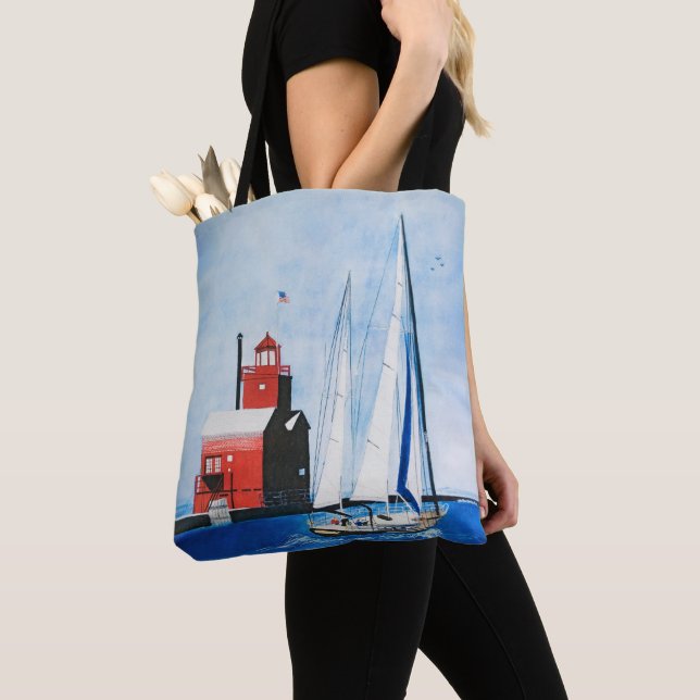 Big Red Michigan Lighthouse and Sailboat Painting Tote Bag (Close Up)