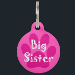 Big Sister Pet ID Tag<br><div class="desc">Nobody messes with Big Sis! Sporting a cute pink paw-print and the "Big Sister" logo in a fun white font, this is another one of Dog Tag Art's pet ID tags of pink-perfection. Whether the wearer of this tag is the oldest sister in your pack of lovable children, furry or...</div>