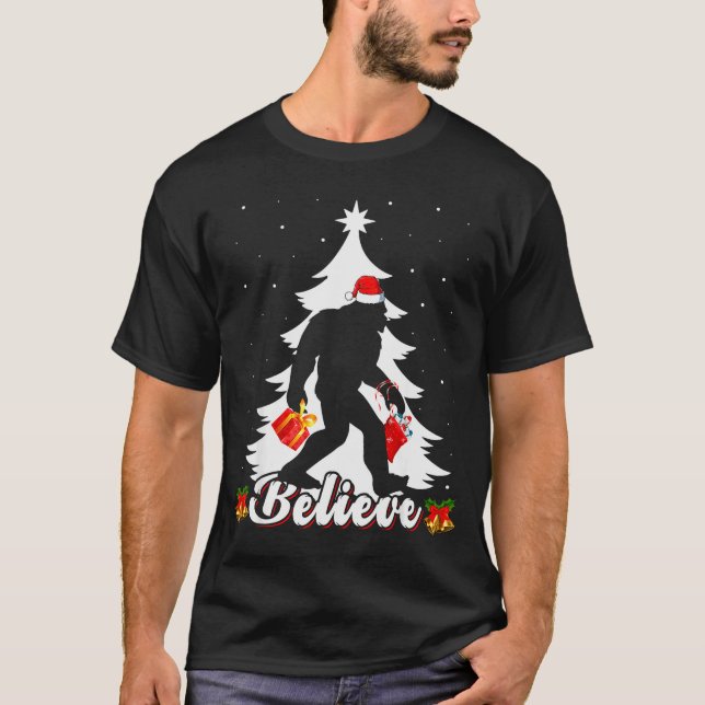 Bigfoot Believe Christmas Tree Funny Santa Sasquat T-Shirt (Front)