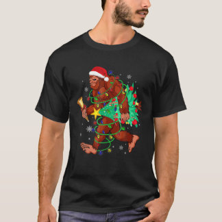 Bigfoot Carrying Christmas Tree Sasquatch Believer T-Shirt